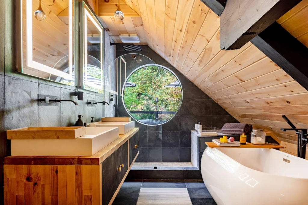 Completed job at an Airbnb bathroom with rounded windows and rustic vibe.